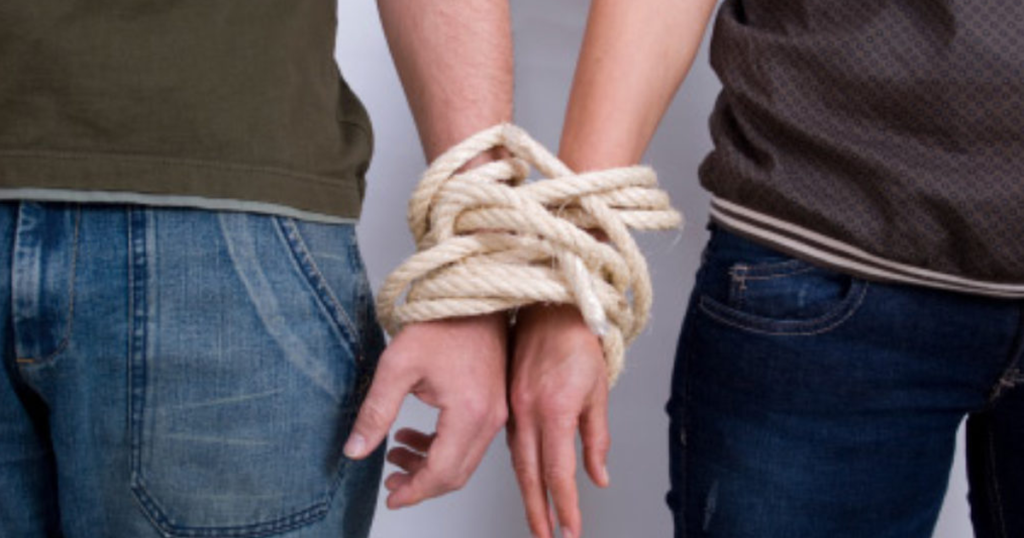 Understanding Codependency in Addiction - A woman holding a pair of feet - Psychology