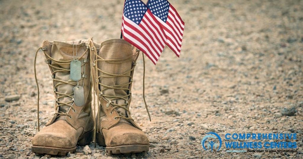 veteran boots next to an american flag
