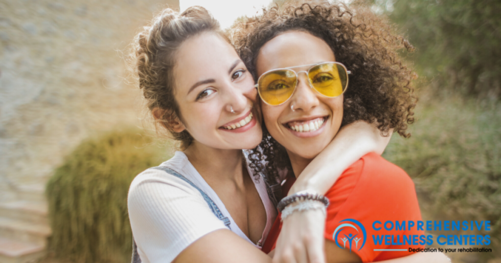 girl hugging her sponsor in recovery